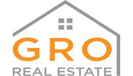 A gray and orange logo for a real estate company.
